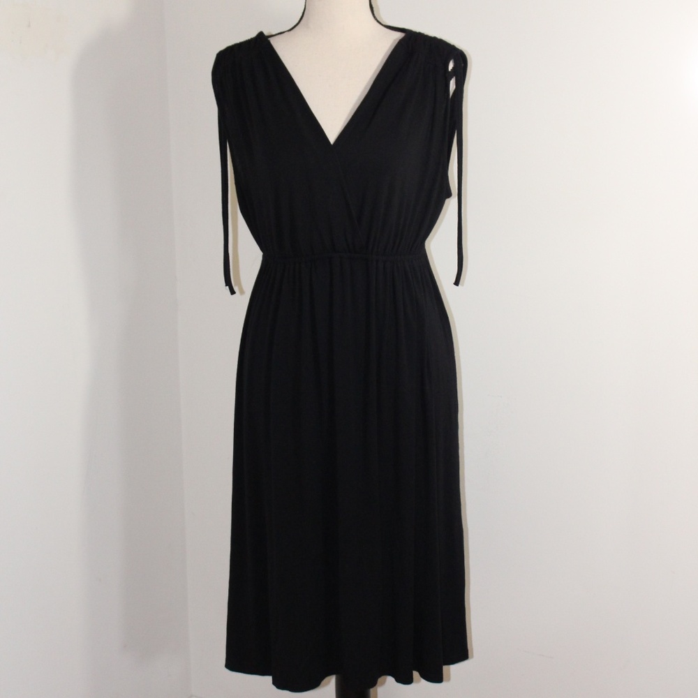 Spencer Jeremy, sleeveless sun dress with elastic waistline and V neckline..